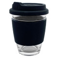 A glass coffee cup with a black silicone sleeve and a matching lid, designed for reusable use.
