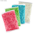 Four bags of jelly beans in pink, green, blue, and white colours, each sealed in clear packaging.