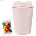 A drink bottle in a light beige hue, featuring a secure lid, accompanied by a pack of colourful jelly beans.