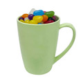 A light green bamboo mug filled with assorted colourful jelly beans and featuring a handle.