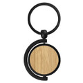A round bamboo key ring with a black metal attachment, featuring a smooth wooden surface.