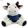 A soft cow plush toy with a happy expression, featuring black and white fur and wearing a navy blue shirt.