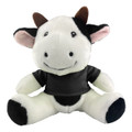 A plush cow toy in black and white with a smiling face and a black shirt, featuring a small logo.