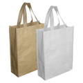 Two paper trade show bags are featured, one in brown and the other in white, both with sturdy handles.