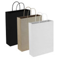 A set of three paper trade show bags in black, brown kraft, and white, each with handles.