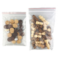 A clear bag containing various wooden game pieces, including brown and beige tokens, dice, and chess-like figures.