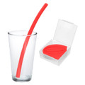 A red silicone straw in a clear glass next to a transparent case holding another red straw.
