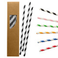 A box containing paper straws in black and white, with additional straws in various colours, including red, green, and pink.