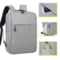 A grey Wirra Backpack featuring multiple compartments and a logo. Includes pockets for a phone and other small items.