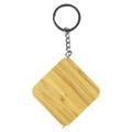 A bamboo tape measure key ring in a square shape, attached to a silver keychain.