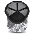 A black and white snow camo trucker cap with a mesh back and a solid black interior. It features a logo on the side.