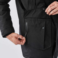 A men's black explorer parka featuring a zippered pocket and a large flap pocket on the front.