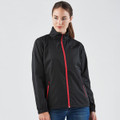 A woman wearing a black rain jacket with red zippers and accents, featuring a collar and side pockets.