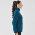 A women's thermal pullover in a deep teal colour, featuring a high collar and side pockets.
