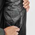 A close-up of a men's thermal jacket in dark green, displaying the inner lining and a label with brand information.