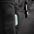 A black backpack featuring multiple compartments and a logo, made from durable material.
