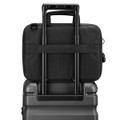 A black laptop sleeve with a handle, positioned on top of a suitcase, showcasing its sleek design.
