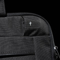 A black laptop sleeve featuring a small logo, showcasing a textured fabric and zip closure.
