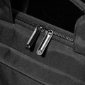 A black laptop sleeve with dual zippers, featuring a sleek and textured fabric design.