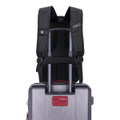 A black Swissdigital Pixel Backpack is attached to a silver trolley suitcase, featuring adjustable straps and a logo.