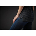 A close-up of a women's crew neck tee in dark grey with subtle stripes, paired with blue jeans.