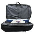 A black backpack with an open interior, featuring grey lining and neatly arranged items including a towel and a shirt.
