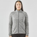 A women's full zip fleece jacket in grey with a high collar and long sleeves, featuring a logo.