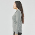 A women's long-sleeve micro pique polo in grey, featuring a collar and a fitted design.