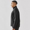 A men's softshell jacket in black, featuring a high collar and a side zip pocket. It has a logo on the chest.
