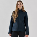 A navy softshell jacket for women with a zippered front and two side pockets. It features a branding logo.