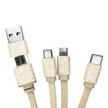 A round bamboo charging cable key ring in a neutral colour with multiple connectors including USB, micro USB, and USB-C.