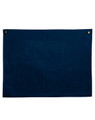 A navy canvas short waist apron featuring a front pocket and metal button accents.
