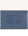 A denim half apron in blue with a front pocket and brass button accents. It has a simple, functional design.