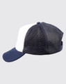 A navy blue and white trucker cap featuring a mesh back and a curved brim, complete with a logo.