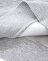 A close-up of a grey crew fleece sweatshirt showing the soft interior fabric and detailed stitching.