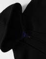 A black men's full-zip fleecy hoodie featuring a hood and a zipper, with a logo visible on the inside.