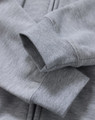A grey men's full-zip fleecy hoodie with a close-up of the cuffs and fabric texture, featuring a logo.