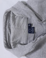 A grey kid's full-zip fleecy hoodie with a hood and a label inside.