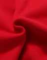 A close-up view of soft, red fleece fabric showing its textured surface. The image features a subtle fold in the material.