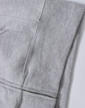 A grey full-zip fleecy hoodie featuring a pocket and a logo. Ideal for casual wear.