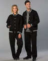 A black fleece varsity jacket with white stripes, worn by a woman and a man, both in matching black pants.