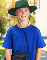A boy wearing a green slouch hat with a break-away clip, paired with a blue t-shirt, smiles outdoors.