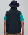 A navy blue surf hat with a clip-on chin strap, worn by a person from the back, paired with a teal shirt.
