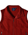 A red softshell vest with a high collar and a logo on the inside label. Features zippered pockets.