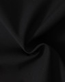 A close-up of black fabric featuring a soft texture, ideal for softshell jackets.