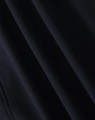 A softshell full zip hoodie in a dark navy colour with a smooth texture and subtle sheen. It features a logo.