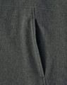 A close-up view of a grey ladies' softshell full zip hoodie showcasing the fabric texture and a zippered pocket.