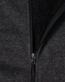 A ladies' grey bonded fleece jacket featuring a zip closure and soft inner lining. It includes a logo on the fabric.