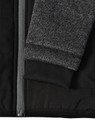 A black quilted body jacket with a heather grey sleeve and ribbed cuffs, featuring a zip closure.