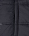 A unisex sustainable seamless parka jacket in black, featuring a 3D cut with visible stitching details.